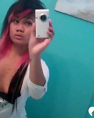 Asian with pink hair posing without her panties