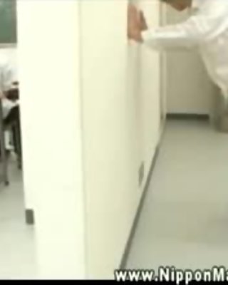 Asian mature teacher plays with students cock in the hallway